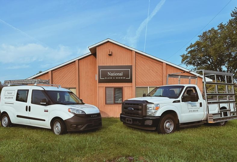 National Glass and Shower storefront with service trucks